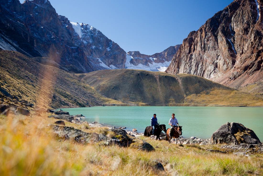 Riding past an alpine lake in Mongolia |  <i>Cam Cope</i>