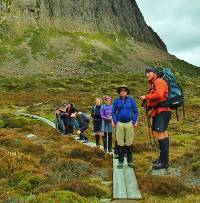 Pausing for interpretation from our guide on the Overland Track |  <i>Ashton Sayer</i>
