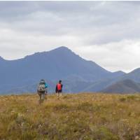 Trekking towards the Ironbound ranges on the South Coast Track in Tasmania | John Dalton