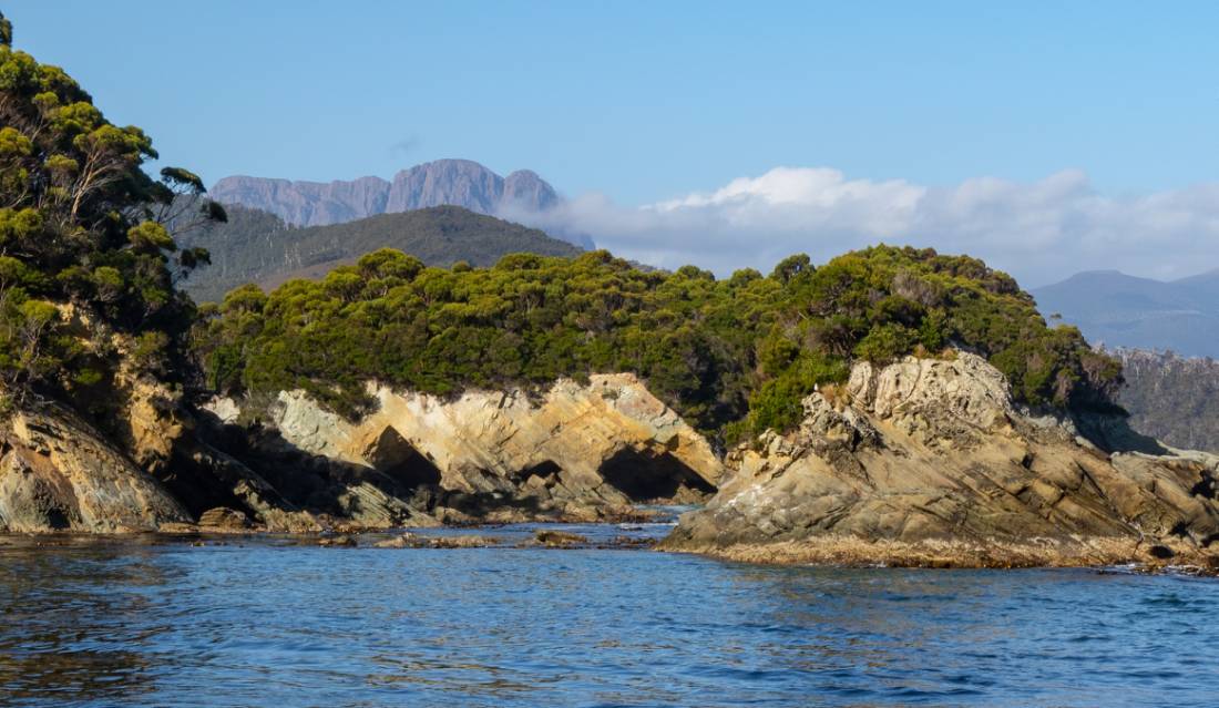 The imposing Ironbound Ranges in the distance on the South Coast Track |  <i>John Dalton</i>