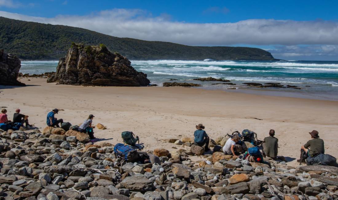 Taking a break on the rugged coastline of the South Coast Track |  <i>John Dalton</i>