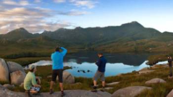 Hikers taking in the breathtaking views of Cradle Mountain and Lake St Clair | Peter Walton