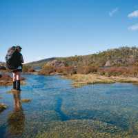 Trekkers carry a full pack on our Walls of Jerusalem self guided walks | Aran Price