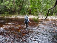 tackling a river crossing on Tasmania's South Coast Track |  <i>Michel Gueneau</i>