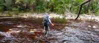 Tackling a river crossing on Tasmania's South Coast Track | Michel Gueneau