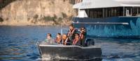 Expedition vessel Odalisque and guests in one of two excursion tenders