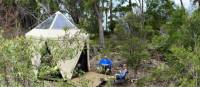 Hikers putting up their feet at our coastal Eco-Comfort Camp | Michael Buggy
