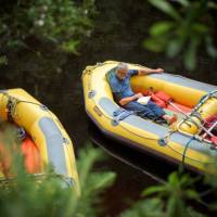 Rafter reading a book in the raft | Glenn Walker