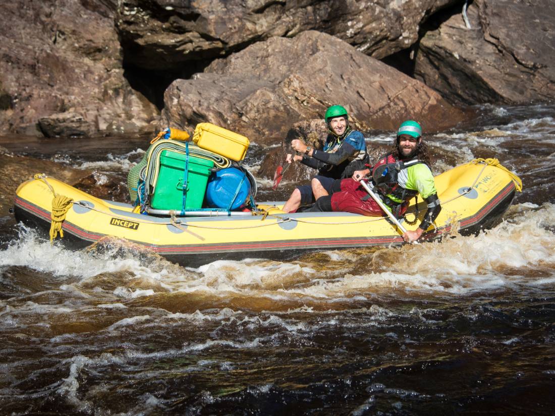 Guides navigating the raft to calmer waters |  <i>Glenn Walker</i>