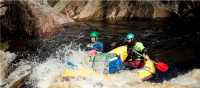 Guides taking the raft through wilder rapids | Glenn Walker
