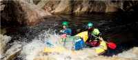 Guides taking the raft through wilder rapids | Glenn Walker
