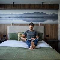 Guest relaxing in expedition vessel Odalisque's boutique cabins