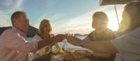Guests enjoy sunset drinks aboard Odalisque