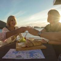 Guests enjoy sunset drinks aboard Odalisque