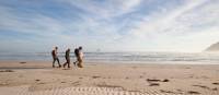 Guests walk along Stephens Bay, a remote beach | Mark Daffey