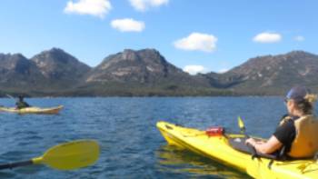 Kayaking in Coles Bay,Ashton Sayer Kayaking in Coles Bay beneath the Hazards