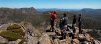 Trekkers enjoying the view with their Tasmanian Expeditions guide from the summit of Mt Jerusalem | Don Fuchs
