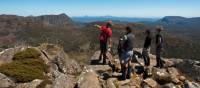 Trekkers enjoying the view with their Tasmanian Expeditions guide from the summit of Mt Jerusalem | Don Fuchs