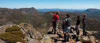 Trekkers enjoying the view with their Tasmanian Expeditions guide from the summit of Mt Jerusalem | Don Fuchs