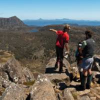 Trekkers enjoying the view with their Tasmanian Expeditions guide from the summit of Mt Jerusalem | Don Fuchs