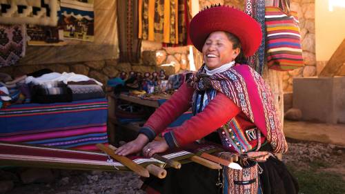 Quechua woman backstrap weaving in Chinchero