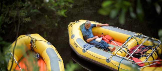 Rafter reading a book in the raft | Glenn Walker