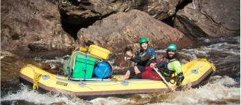 Guides navigating the raft to calmer waters | Glenn Walker